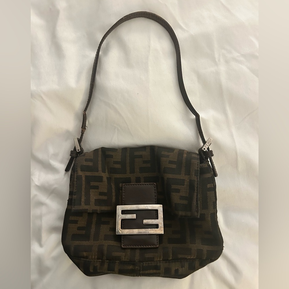 Good condition with the exception of the strap on the right.